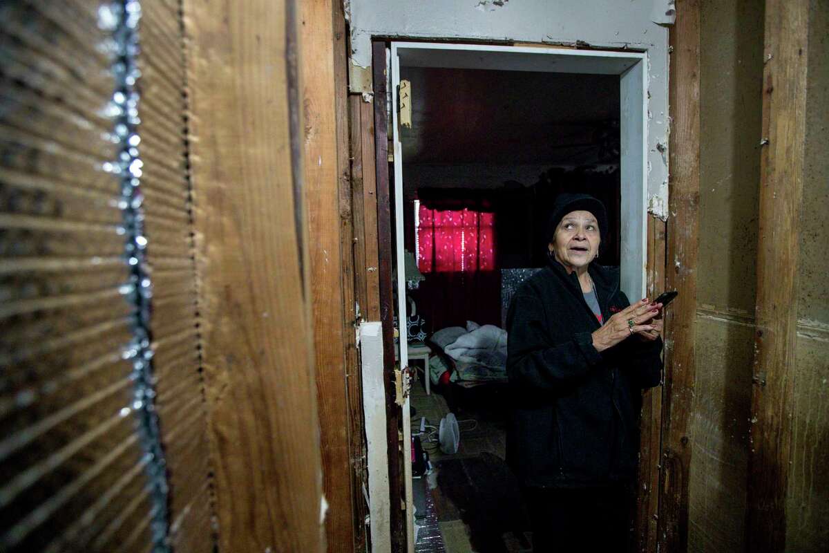 Paula Castro, 66, talks about the process of rebuilding after Hurricane Harvey brought several feet of water into her home, Wednesday, Jan. 3, 2018, in Houston. Castro's son put up temporary insulation in the home to help her deal with freezing temperatures during the previous few nights. Castro said an error in her application for FEMA aid kept her from getting enough money to repair more of her home. ( Jon Shapley / Houston Chronicle )