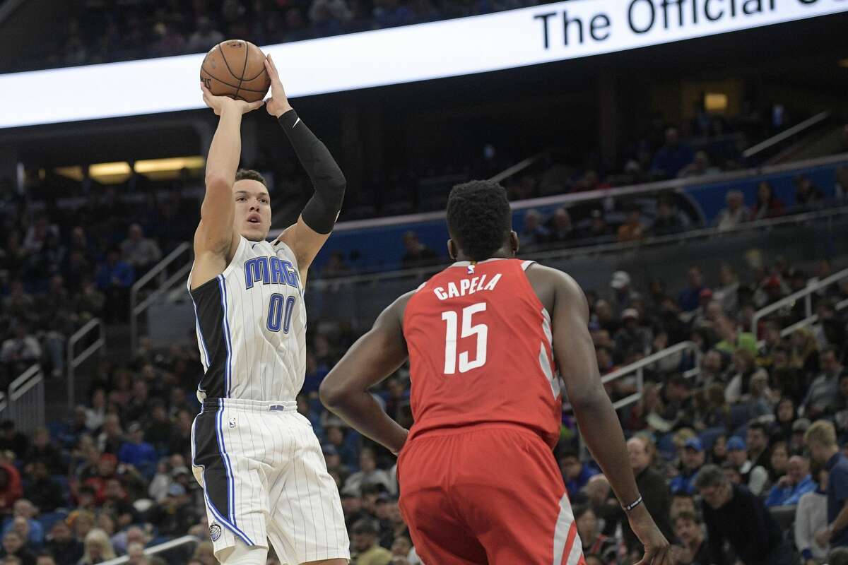 Orlando Magic forward Aaron Gordon (00) goes up for a shot in front of Houston Rockets center Clint Capela (15) during the first half of an NBA basketball game Wednesday, Jan. 3, 2018, in Orlando, Fla. (AP Photo/Phelan M. Ebenhack)