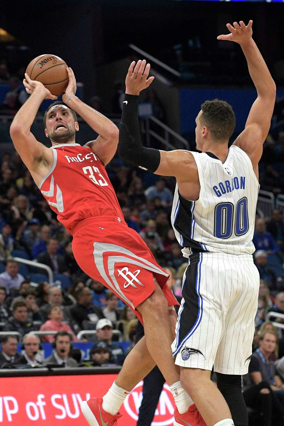 Rockets forward Ryan Anderson tries to get a shot off despite being fouled by Magic forward Aaron Gordon. Anderson turned in a 17-point performance.