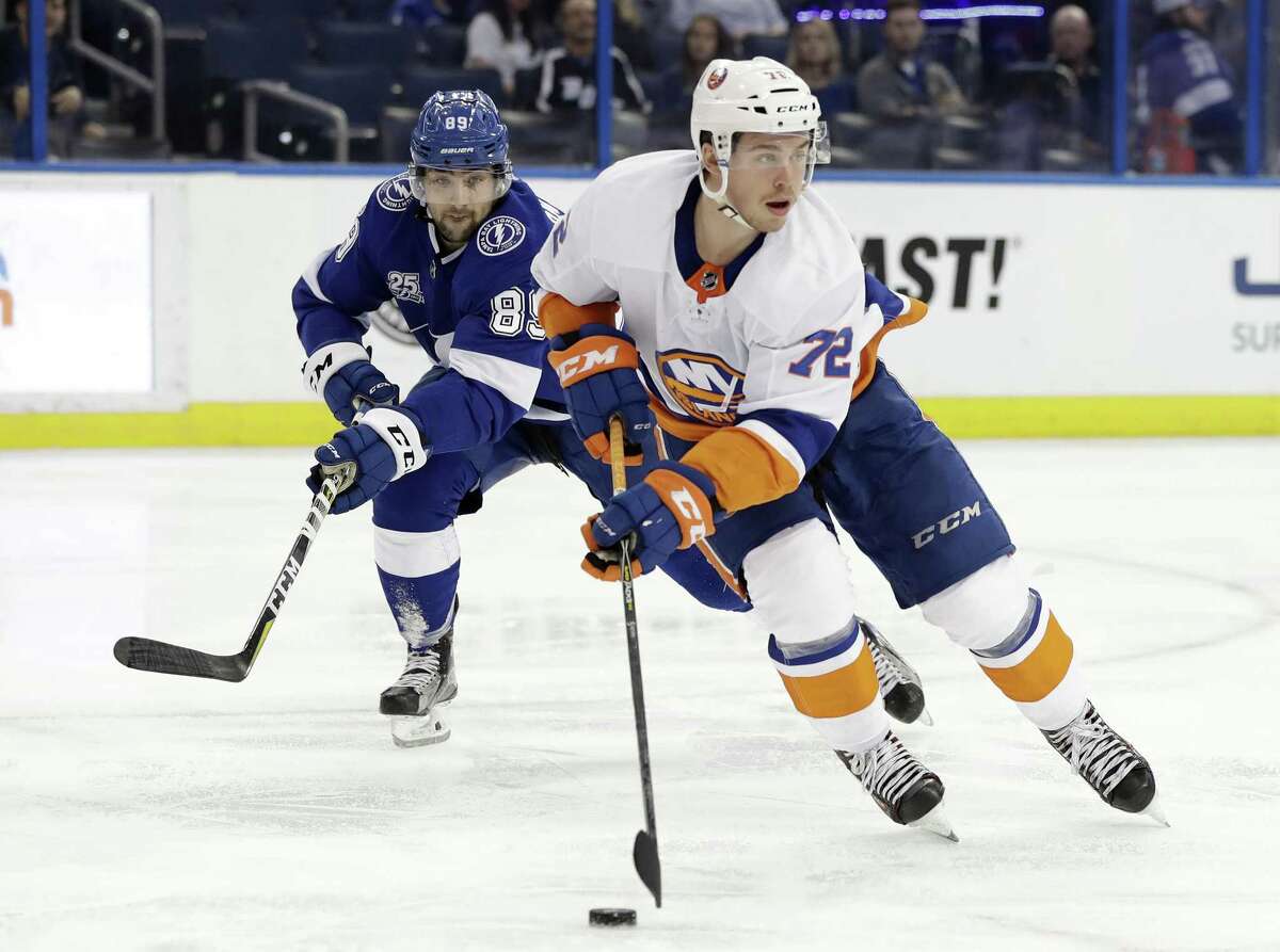 New York Islanders center Anthony Beauvillier (72) carries the puck in front of Tampa Bay Lightning center Cory Conacher (89) during the second period of an NHL hockey game Tuesday, Dec. 5, 2017, in Tampa, Fla. (AP Photo/Chris O'Meara)