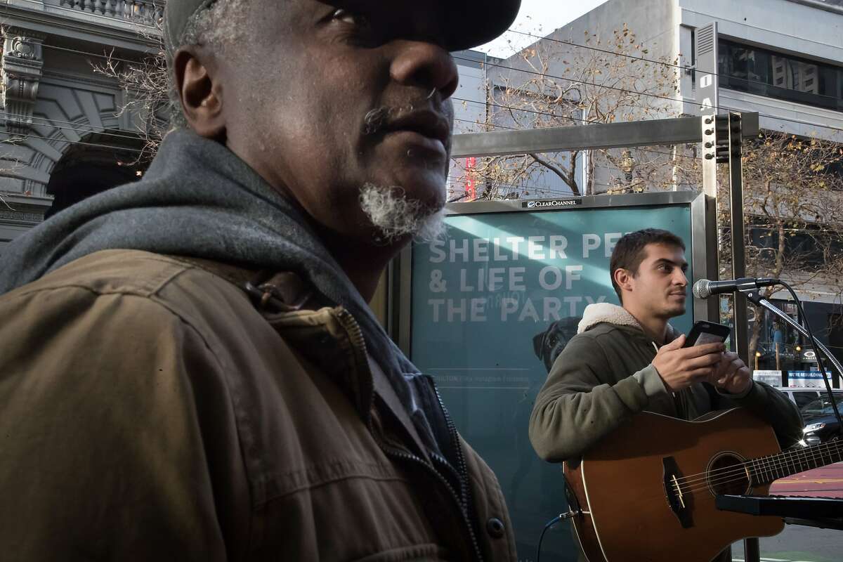 Singer Jamal Corrie, who was performing downtown, plays some keyboard music he performs to Robert Moses on Saturday, Dec. 30, 2017 in San Francisco, Calif. Moses of Robert Moses Kin is putting together The Bootstrap Project which will show street performers in February.