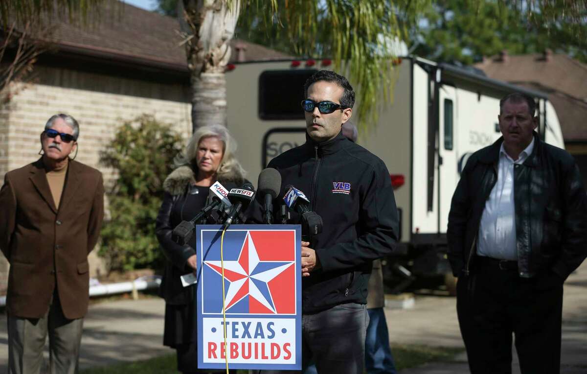 Commissioner of the Texas General Land Office George P. Bush answers questions from the press while visiting homeowner Scott Short, 66, who received a FEMA RV about two weeks ago, on Thursday, Jan. 4, 2018, in League City. Short has been living in his house on Chalmette Street for 22 years and the house was flooded during Hurricane Harvey.