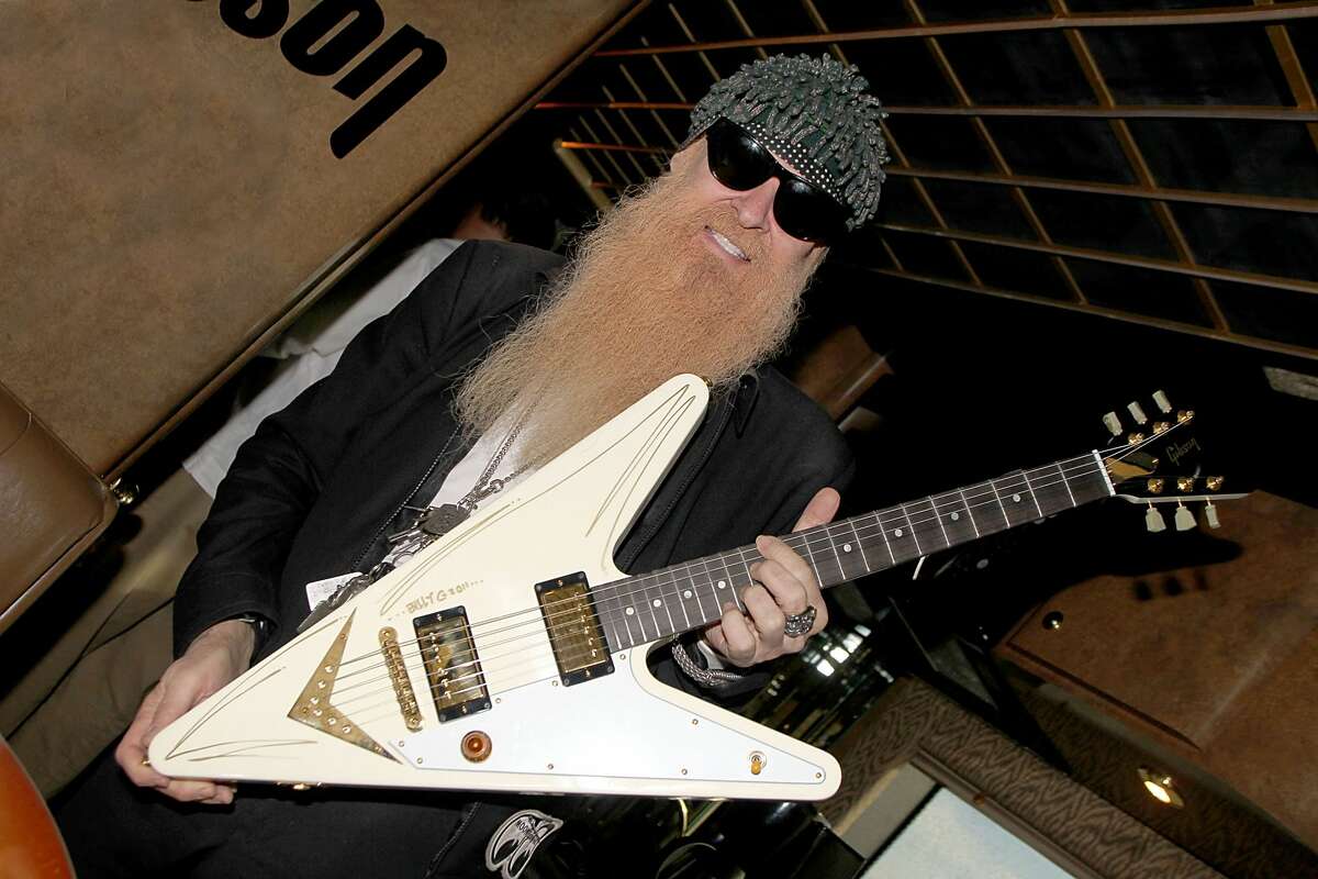 Musician/vocalist Billy Gibbons of ZZ Top signs a Gibson Reverse Flying V on the Gibson Guitars bus on Jan. 28, 2011 in San Antonio, Texas.