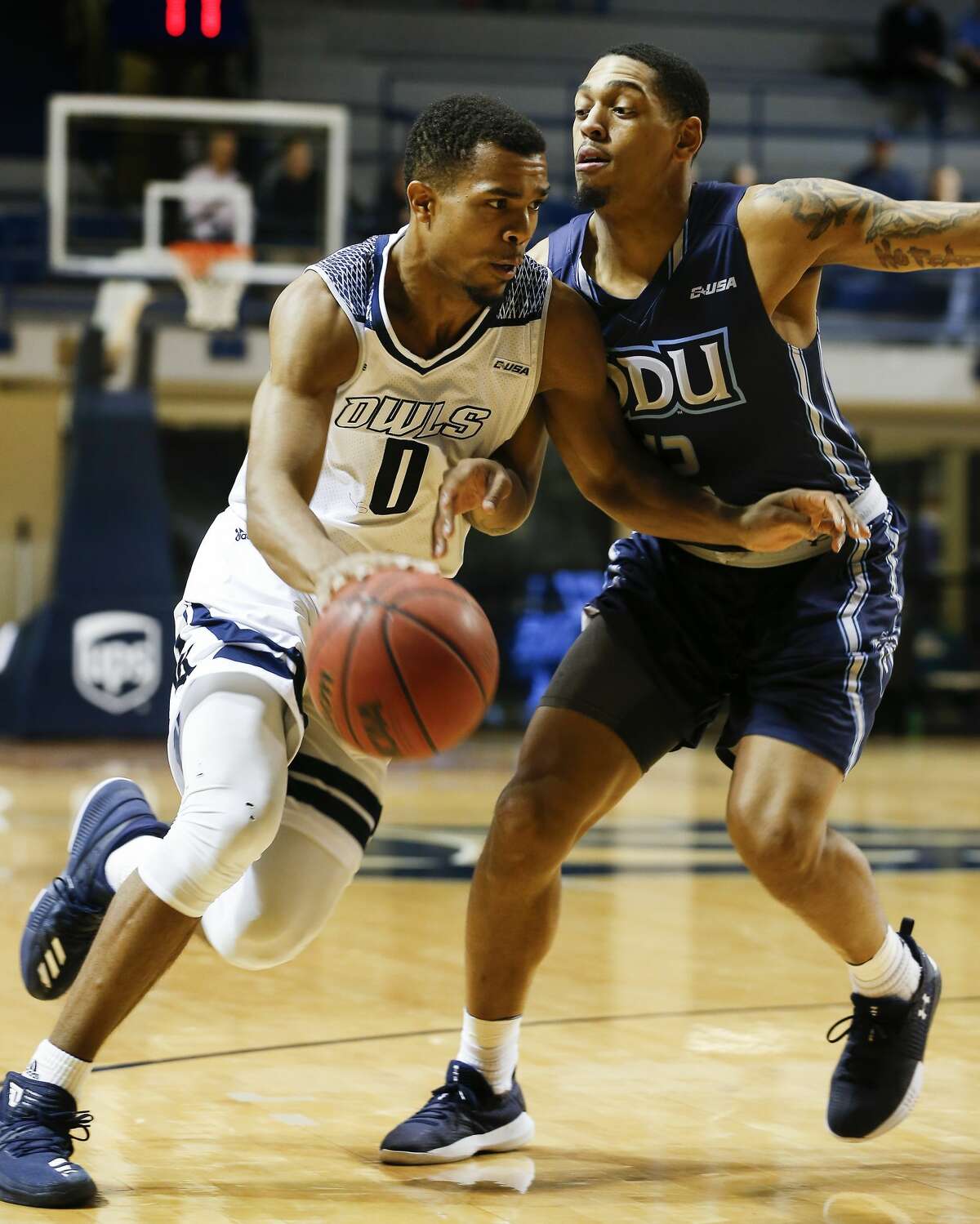 Rice guard Connor Cashaw drives around Old Dominion guard Randy Haynes Thursday, Jan. 4, 2018, in Houston. ( Steve Gonzales / Houston Chronicle )