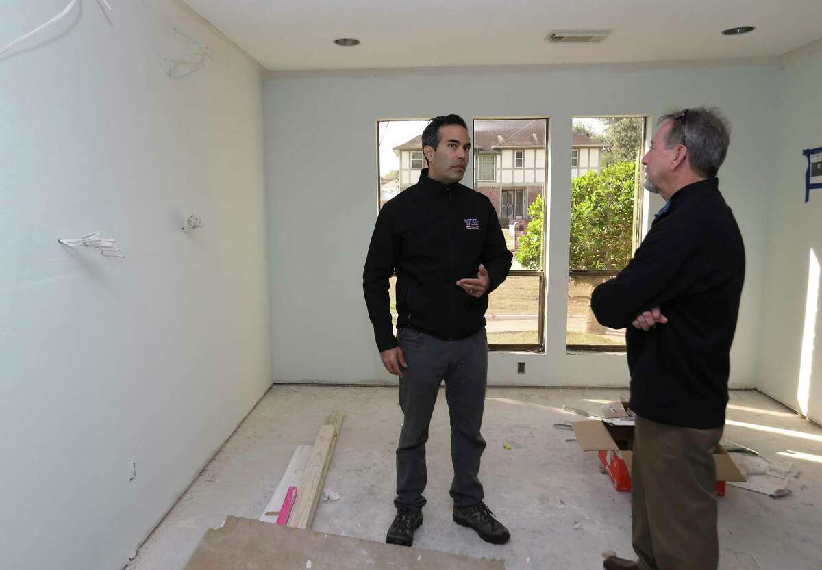Texas Land Commissioner George P. Bush ﻿walks through Scott Short's house, damaged in Hurricane Harvey, in League City on Thursday. ﻿Short, 66, ﻿﻿is﻿ living in a FEMA RV, which he received about two weeks ago, while he renovates his home. ﻿