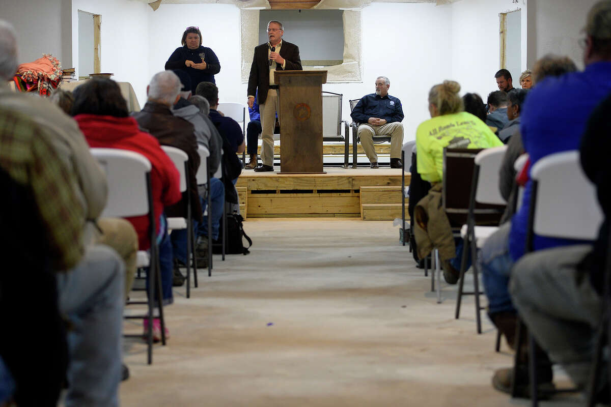 Brian Bartley with the National Flood Insurance Program speaks during a public forum for flood victims at Rose City Baptist Church on Thursday evening. The church itself is still repairing their flood damages. Photo taken Thursday 1/4/18 Ryan Pelham/The Enterprise