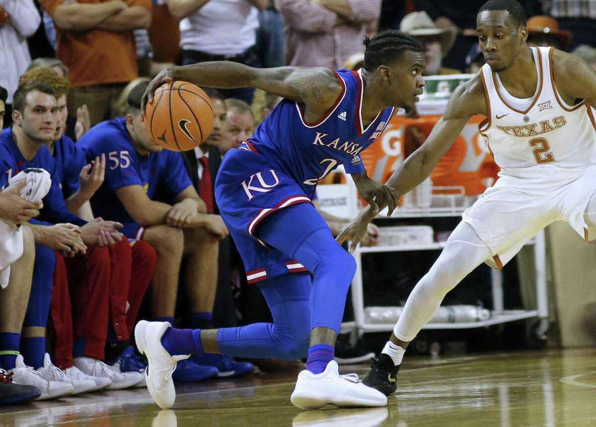 AUSTIN, TX - DECEMBER 29: Lagerald Vick #2 of the Kansas Jayhawks moves with the ball against Matt Coleman #2 of the Texas Longhorns at the Frank Erwin Center on December 29, 2017 in Austin, Texas. (Photo by Chris Covatta/Getty Images)