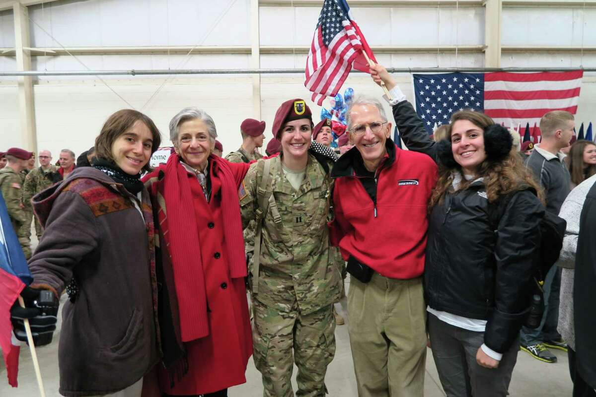 U.S. District Judge Lee H. Rosenthal, husband Gary, and her twin daughters Jessica, left, and Rachel, right, welcome back another daughter, Capt. Hannah Rosenthal, of the Army's 82nd Airborne after the first of two deployments to Afghanistan on Nov. 16, 2014. Their eldest daughter Rebecca is not pictured.