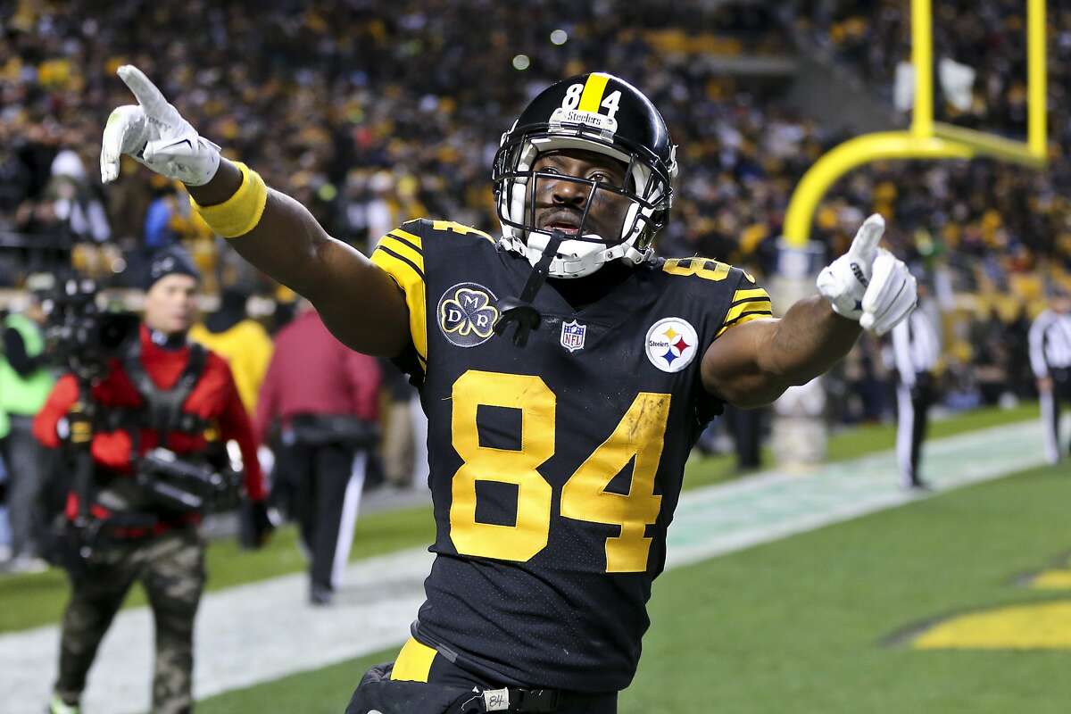 FILE - In this Thursday, Nov. 16, 2017 file photo, Pittsburgh Steelers wide receiver Antonio Brown celebrates after he made a touchdown catch during an NFL football game against the Tennessee Titans in Pittsburgh. 
