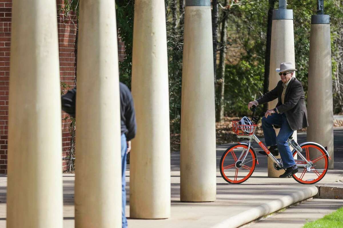 Peter Doyle takes a bike out for a test ride as The Woodlands introduces a new dockless bike sharing program, MoBike, at Town Green Park Friday, Jan. 5, 2018. The bikes don't need to be returned to a specific location at the end of a users ride and can be unlocked by a new user with phone app. ( Michael Ciaglo / Houston Chronicle)