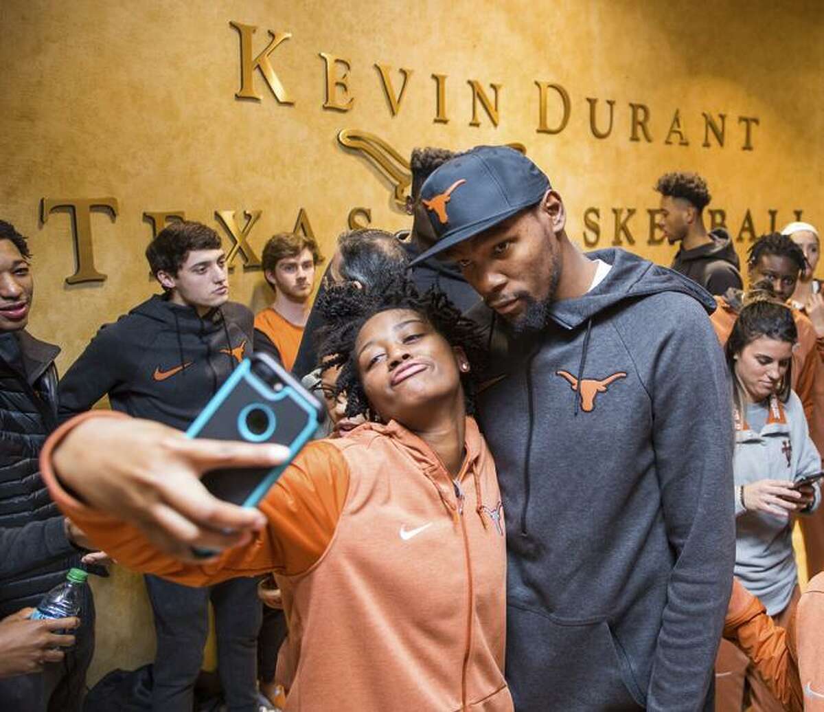 University of Texas women's basketball player Jordan Hosey poses for a selfie with Kevin Durant following the unveiling of the Kevin Durant Texas Basketball Center on Friday, Jan. 5, 2018 in Austin, Texas. The basketball facilities have received numerous upgrades and renovations in the past year and there are more to come with help from another $3 million donated by Durant.