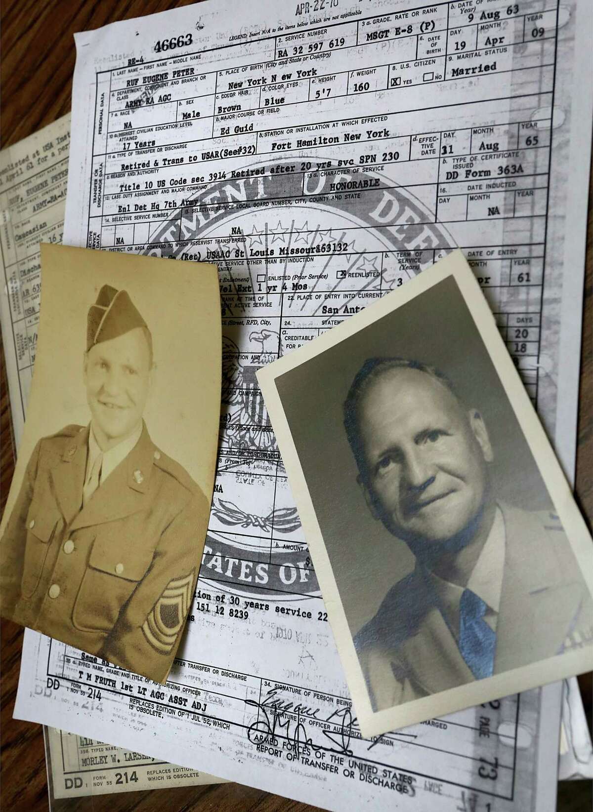 LEFT: Old photos and military discharge papers of Eugene Ruf, a veteran of World War II, who celebrated his 108th birthday on Wednesday, April 19, 2017, at Brookdale Senior Living Solutions with family and friends.