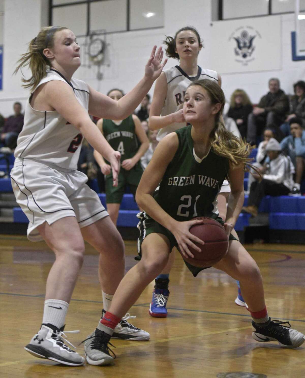 New Milford's Gillian Boss (21), a junior transfer from Florida, is averaging 20 points per game as the Green Wave have gotten off to a 5-1 start.