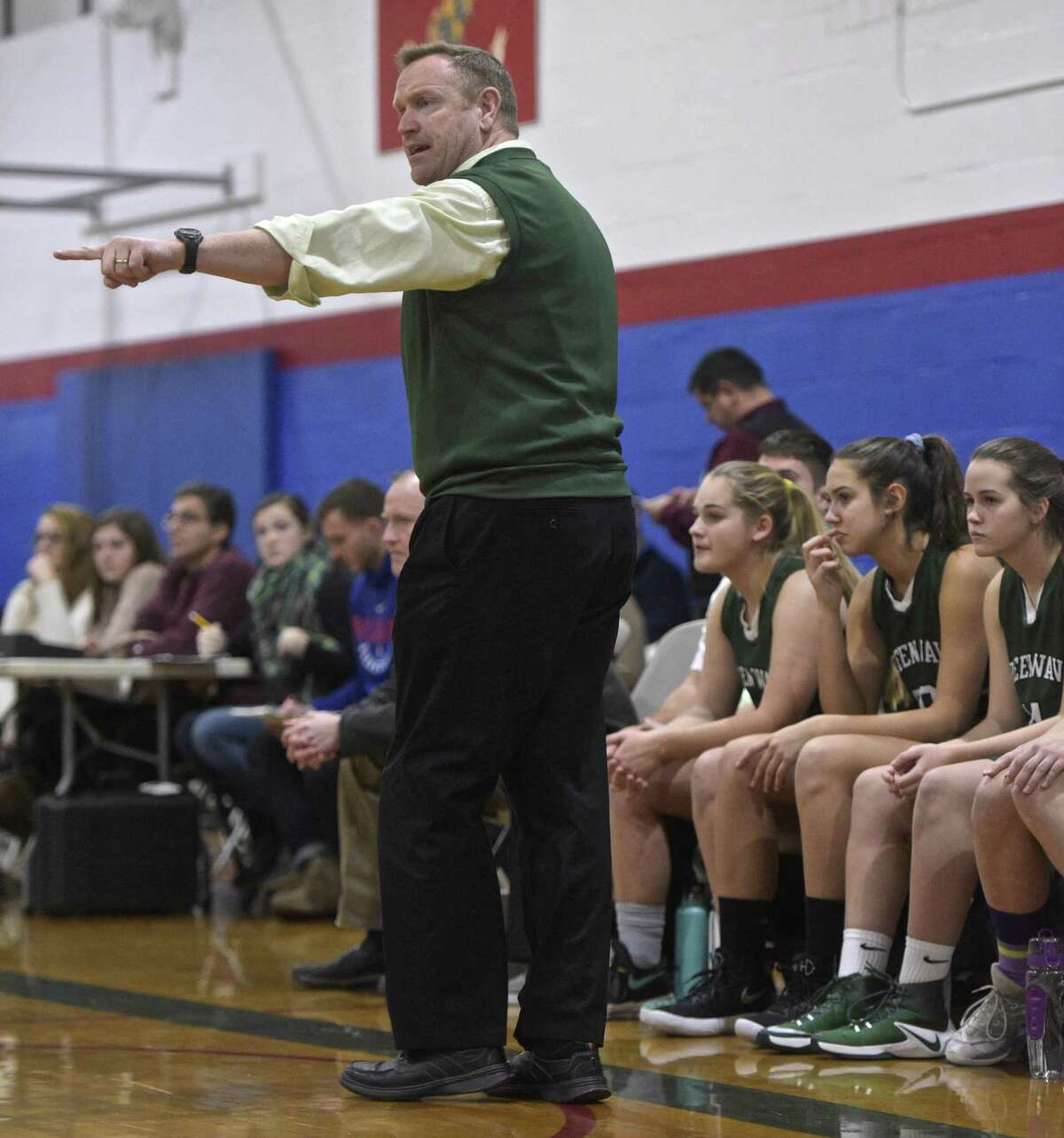 New Milford head coach Bill Kersten talks with a player during the consolation game of the 13th Annual The News-Times Greater Danbury Holiday Festival girls high school basketball tournament. Thursday, December 28, 2017, at the Danbury War Memorial, in Danbury, Conn.