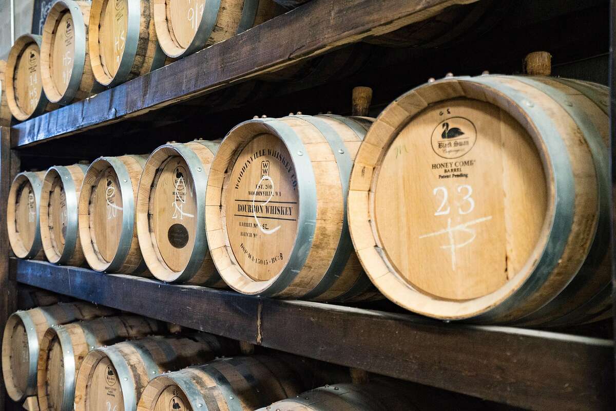 Bottles and barrels at de Vine Spirits, a craft distillery on Vancouver Island near Victoria.