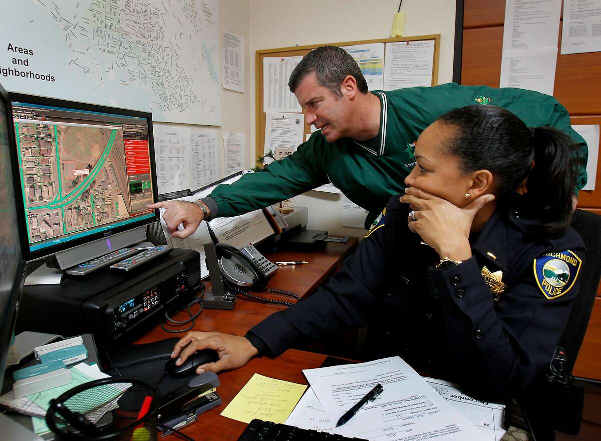 Captain Mark Gagan (left) and Lieutenant Bisa French watch as a gunshot incident is recorded on one of their Shotspotter stations. The Shotspotter hardware and software is used by several police departments in the Bay Area, like Richmond, Calif. to pinpoint gun shot locations and aid officers in investigation and prosecution.