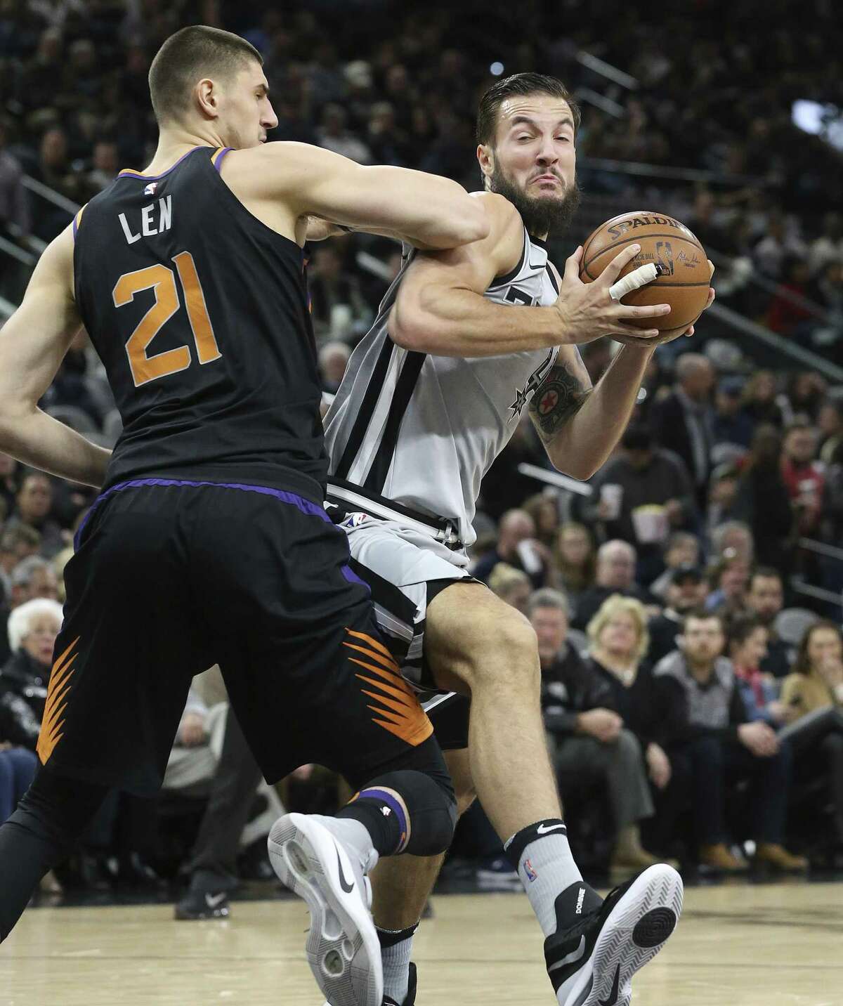 Joffrey Lauvergne is guarded closely by Alex Len in the lane as the Spurs host the Suns at the AT&T Center on January 5, 2018