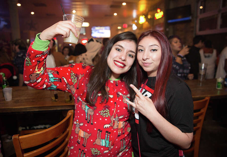 Locals warmed up Friday night Jan. 5, 2018,at downtown bars with cosy, warm onesies and alcohol. It was the First Friday Onise Pub Run. Photo: B. Kay Richter For MySA