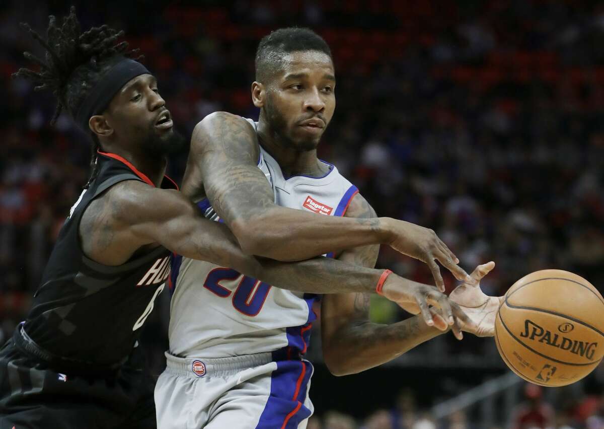 Houston Rockets guard Briante Weber (0) knocks the ball away from Detroit Pistons guard Dwight Buycks (20) during the first half of an NBA basketball game, Saturday, Jan. 6, 2018, in Detroit. (AP Photo/Carlos Osorio)