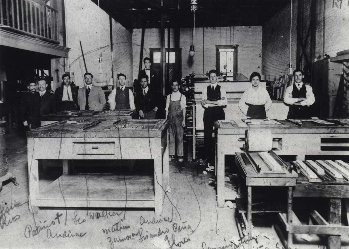 Jovita Idar (second from right) stands in the print shop of El Progreso, a newspaper she worked for in Laredo in the early 1900s. She was a rarity in what was then a male-dominated industry. The other newspaper employees are identified in handwriting on the photo, dated as 1914. That year, she held off Texas Rangers who were trying to shut down the paper after it published an editorial critical of the U.S. invasion of Veracruz.