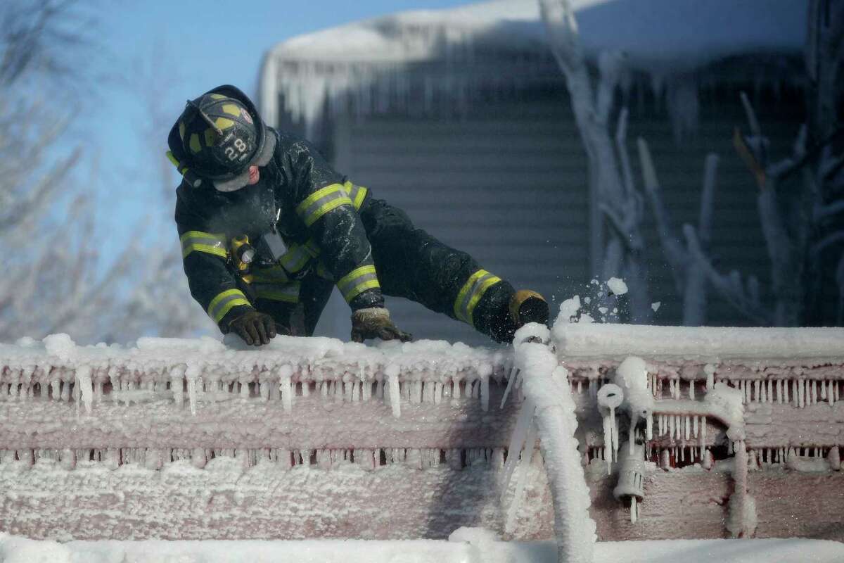 Firefighters Battle The Flames And The Ice