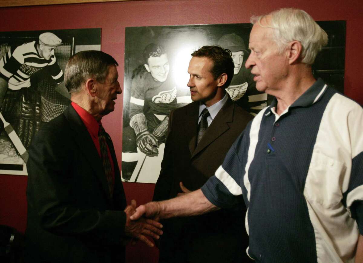 FILE — Detroit Red Wings captain Steve Yzerman, center, meets with Ted Lindsay, left, and Gordie Howe after Yzerman announced his retirement from hockey in Detroit, Monday, July 3, 2006. Yzerman played for 23 seasons and played in 1,514 games, scored 692 goals and tallied 1,063 assists. (AP Photo/Carlos Osorio)