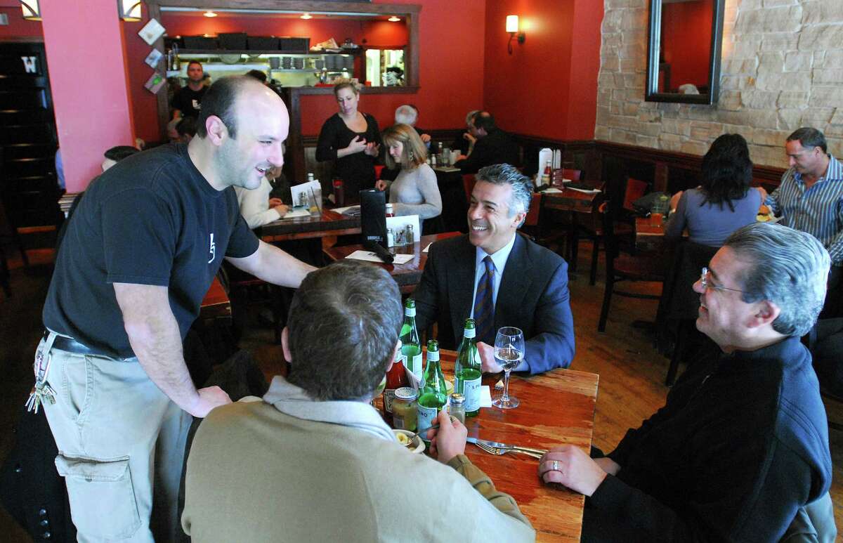 Cas100201 02/01/10 New Haven-- Chris Candito, one of the partners that owns Temple Grill chats with lunch customers Ron LoRicco, top, his brother Richard Loricco, right and Neil Prete. The LoRicco's are from New Haven and Prete is from Orange. Photo-Peter Casolino