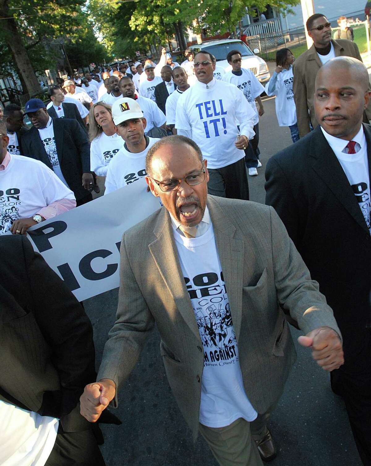 9/18/07 Photo-Casolino Cas070918 New Haven--Bishop Ted Brooks leads the chant along Newhall Street as scores of anti-violence protestors marched in unity to stop violent crime. On the right is New Haven Assistant Police Chief Herman Badger. -Photo-Peter Casolino