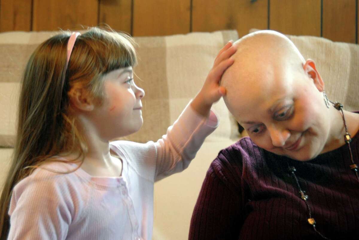 Rebecca Dematteo feels the head of her aunt Ann as her aunt tries to explain to her about cancer. 09/16/08 vmwilliams