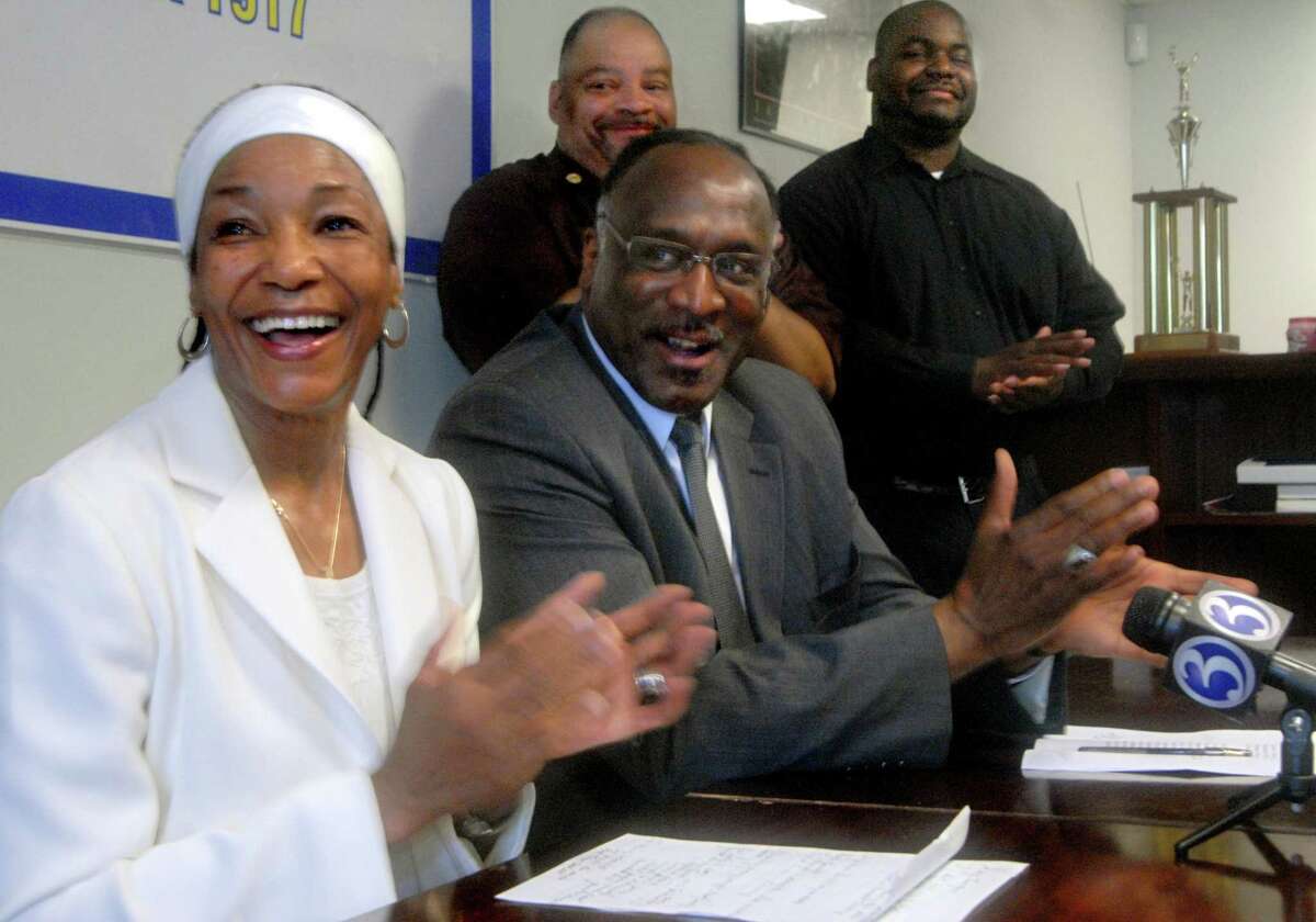 (ms06129)-Emma Jones (L), and James Rawlings, President of the Greater New Haven chapter of the NAACP; speak to the press at the chapter headquarters. In the background are NAACP board members Tony Dawson (L), Divine Shabazz. Melanie Stengel/register