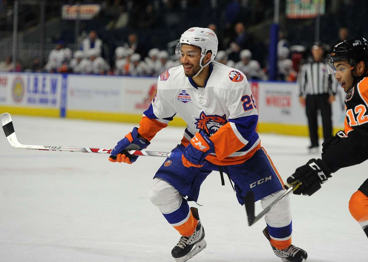 Bridgeport Sound Tiger Josh Ho-Sang smiles while being defended by Lehigh Valley's Tyrell Goulbourne during their AHL hockey game at the Webster Bank Arena in Bridgeport, Conn. on Wednesday, November 8, 2017.