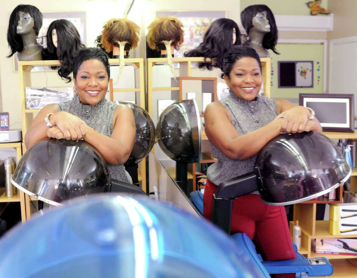 Karaine Holness, owner of Hair's Kay Academy of Cosmetology on Fitch Street in New Haven, Connecticut March 13, 2013, a new not-for-profit cosmetology school. Holness wants to creat jobs and opportunity in her community. Photo by Peter Hvizdak / New Haven Register