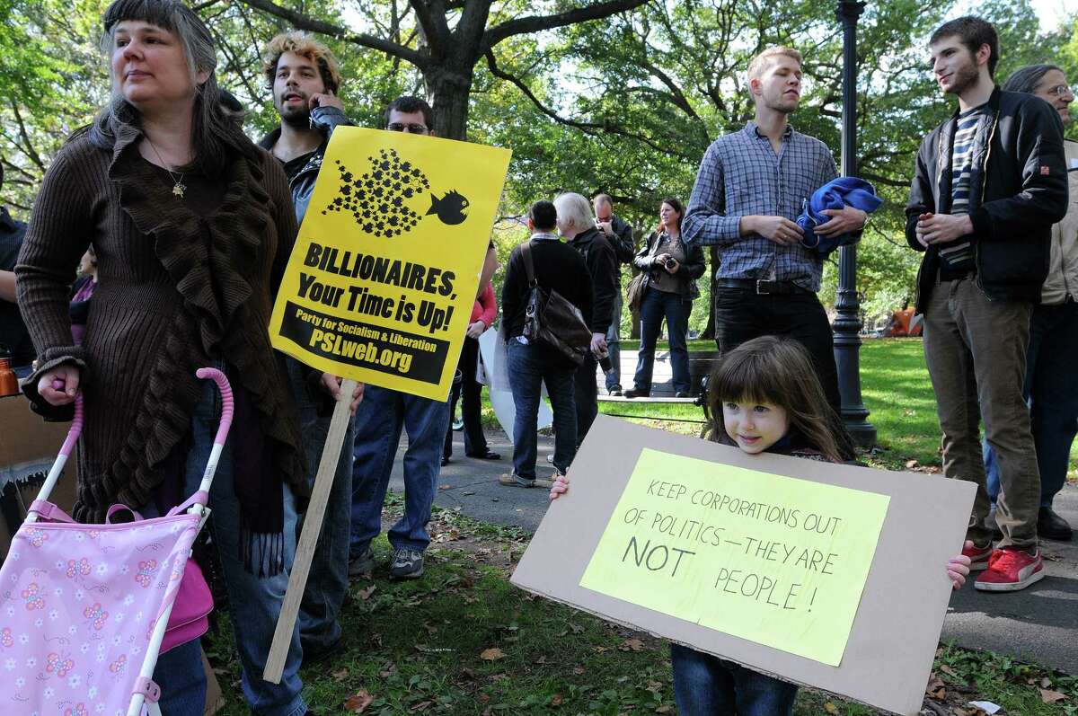 New Haven-- 4-Year-old Veronica Berkowitz along with her mother, Jackie Simmons gather on the green before activists march around New Haven during the Occupy New Haven protests. They are from Trumbull. Peter Casolino/New Haven Register. 10/15/11