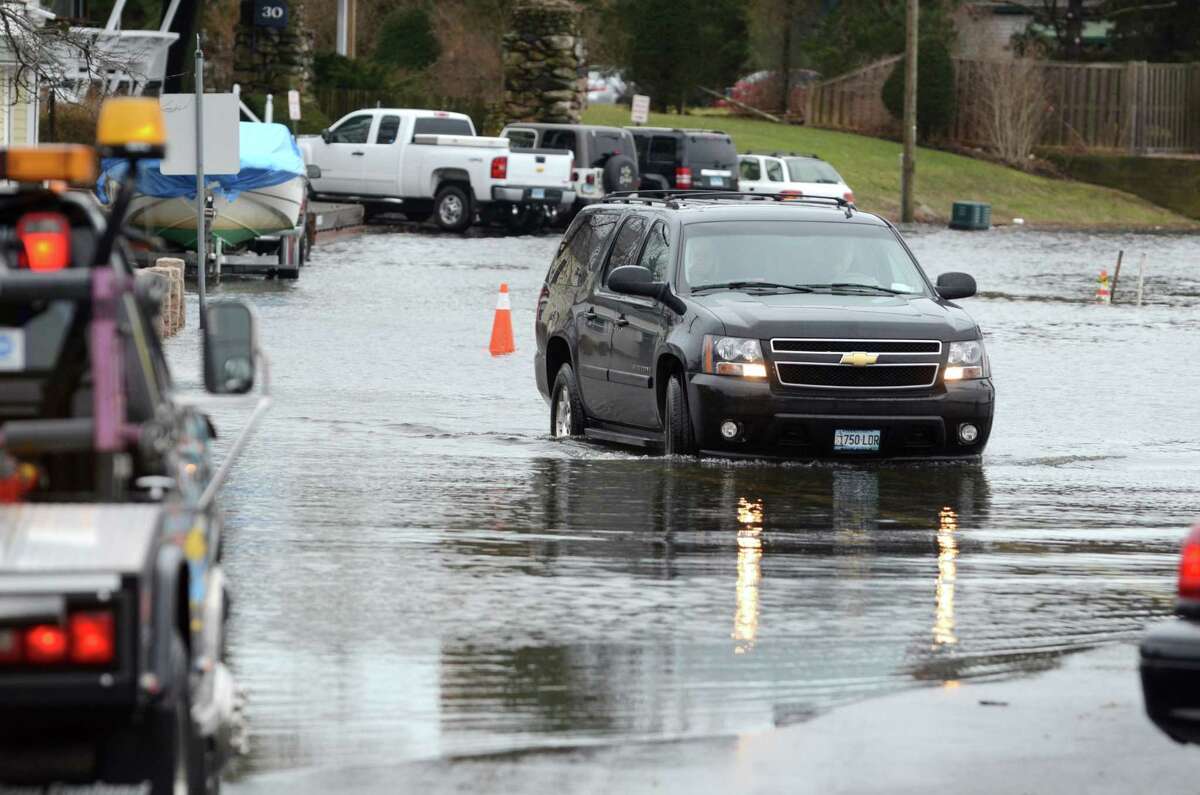A truck maneuvers through the water at the corner of Thimble Island Rd and Three Elms Rd in Stony Creek in Branford. VM Williams 01.12.2012