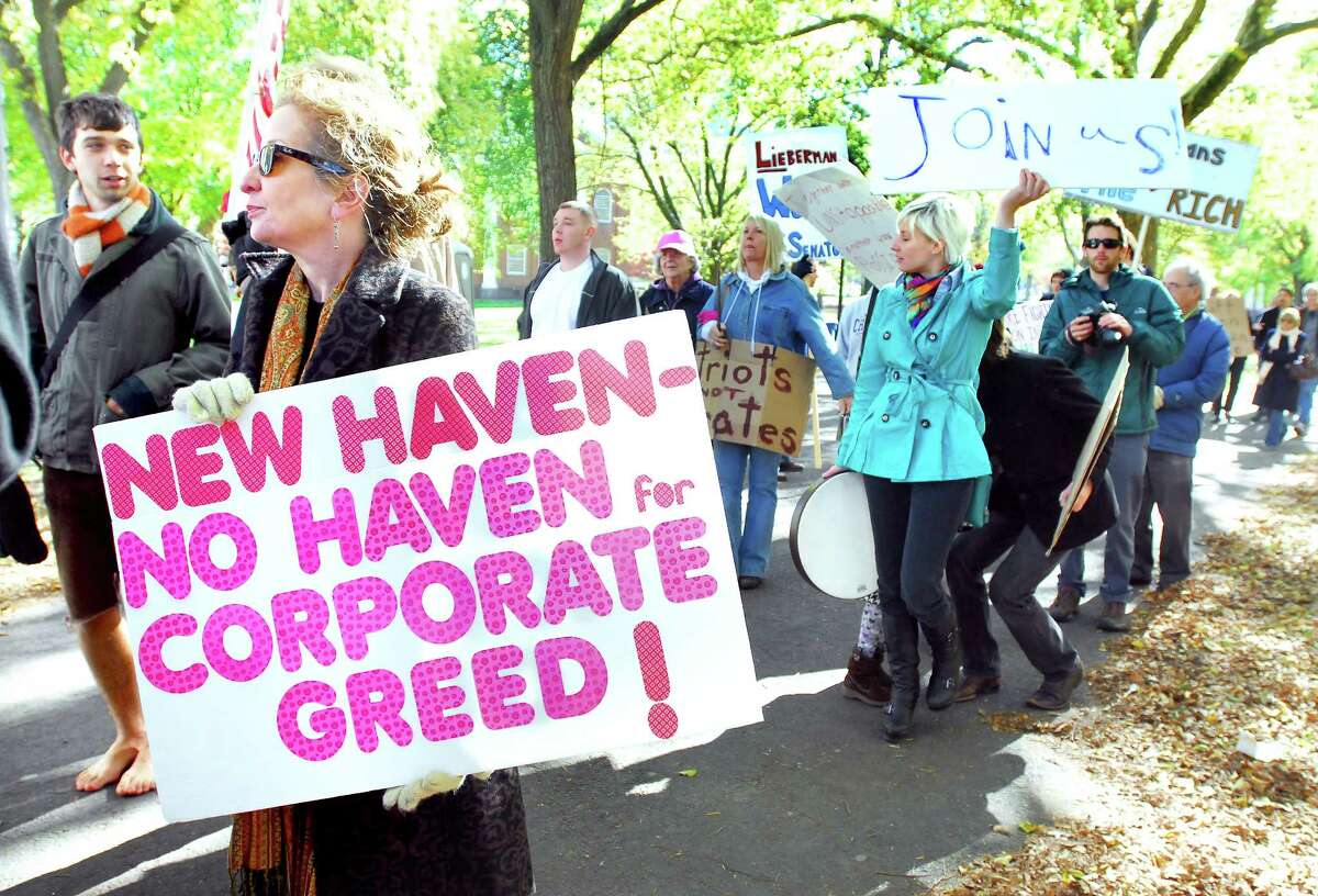 Kate DeTello Culpepper (left) of New Haven participates in an Occupy New Haven march starting on the Upper Green in New Haven on 11/5/2011. Photo by Arnold Gold/New Haven Register AG0429D