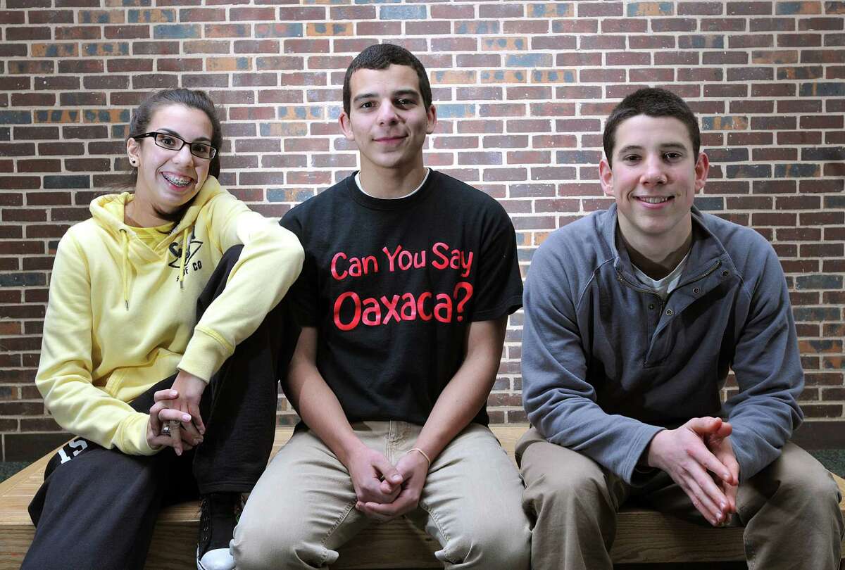 Guilford-- Guilford High juniors Samantha Berry, Juan Lluberes, center, and David Kirwin are traveling to Oaxaca, Mexico on a community service trip with the group "Simply Smiles.". Photo by Peter Casolino/New Haven Register 02/10/11 Cas110210