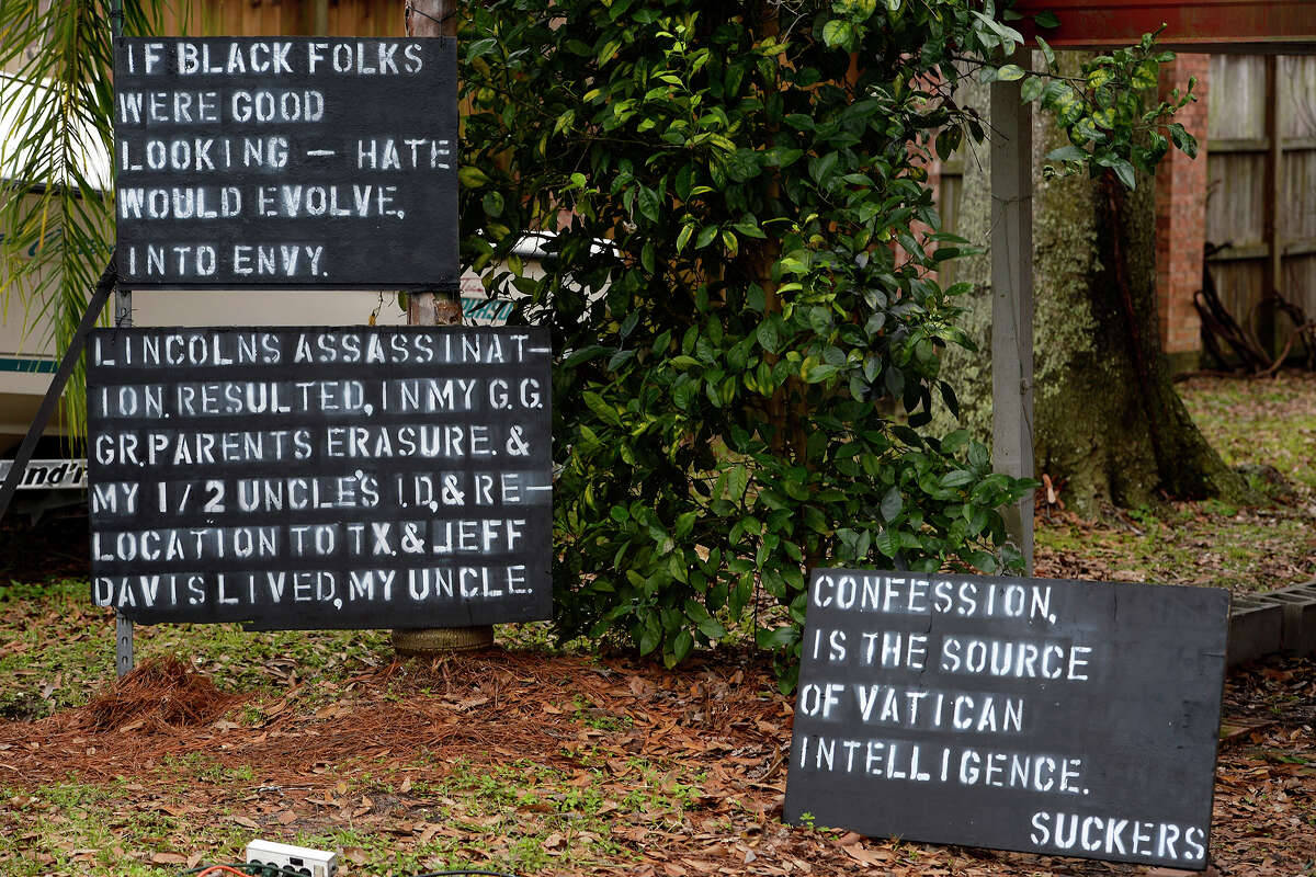 Signs commenting on race, the Catholic Church and the assassination of President Abraham Lincoln outside of a home on Taft Avenue in Groves. Photo taken Monday 1/8/18 Ryan Pelham/The Enterprise