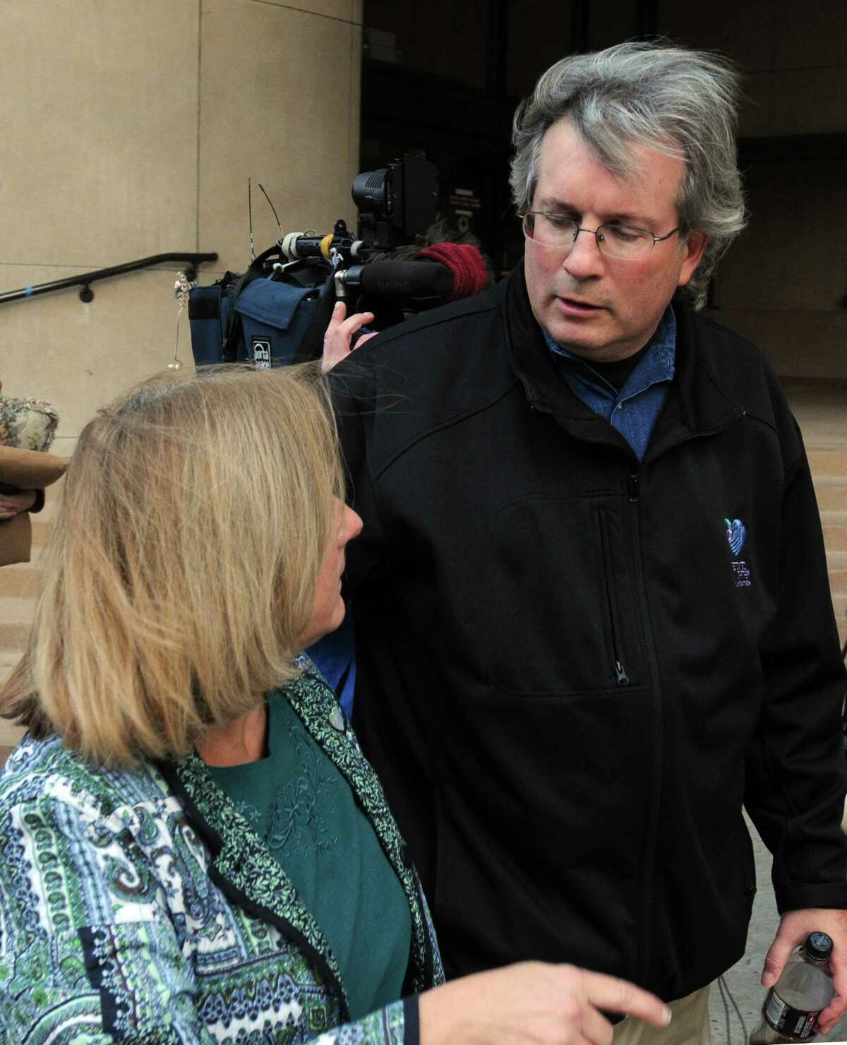 New Haven--Dr. William Petit Jr. leaves Superior Court with an unidentified woman. The jury has not decided on a sentence in the Steven Hayes trial. Photo by Mara Lavitt/New Haven Register 11/6/10