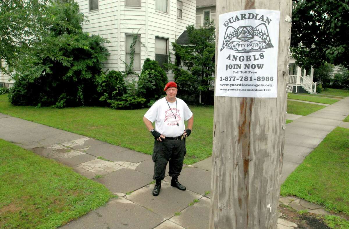 Photography by PETER HVIZDAK ph2126 #2800 New Haven, Connecticut - July 21, 2010: Mark DelGuidice of Norwalk, a member of the New Haven chapter of the Guardian Angels, stands watch Wednesday evening at the corner of Ellsworth Ave. and Maple Street in New Haven.