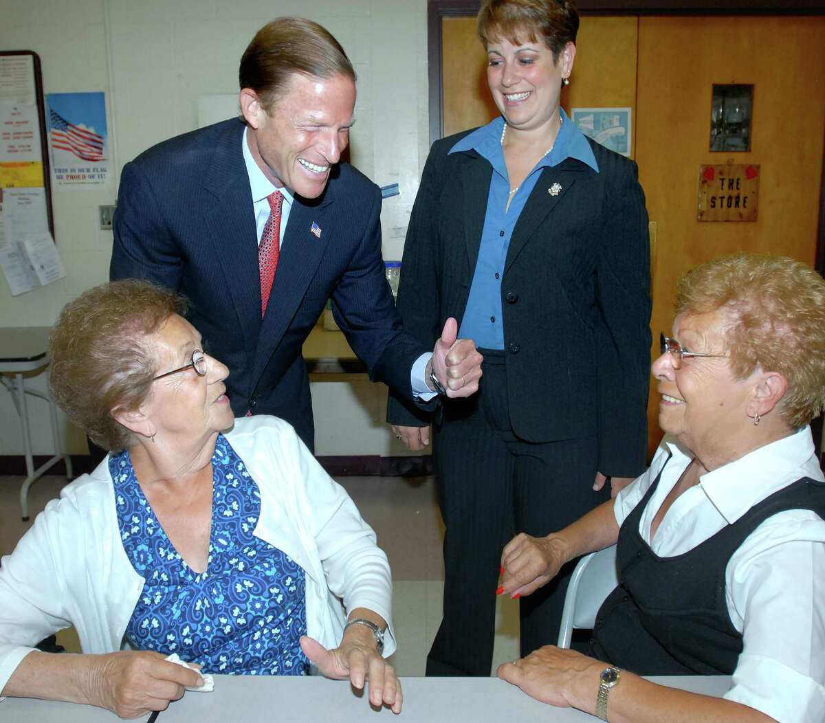 Attorney General Richard Blumenthal (top left) and East Haven Mayor Mayor April Capone Almon (top right) talk with Bridget Mathews (bottom left) and Sarah Cerilli (bottom right) of East Haven at the East Haven Community Center on 7/21/2010. Photo by Arnold Gold AG0378E