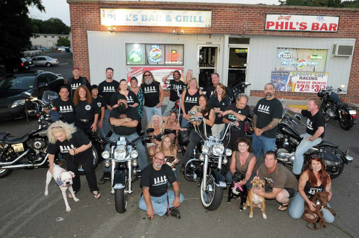 Photography by Peter Hvizdak ph2145 #4355 North Haven, Connecticut - August 20, 2010: Motorcylists and friends of Bikers Against Animal Cruelty in front of Paul's Bar & Grill in North Haven during a gathering of motorcylists and supporters involved in the organization.
