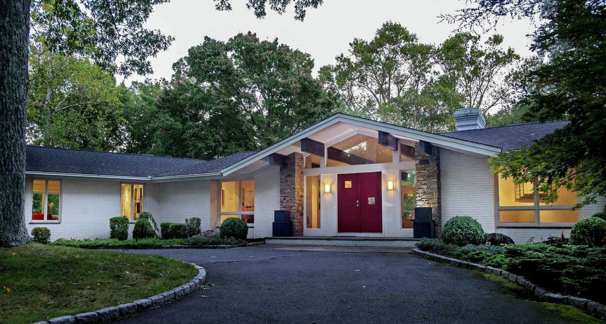 The white brick contemporary house at 153 Proprietors Crossing was inspired by New Canaans legacy of mid-century moderns.