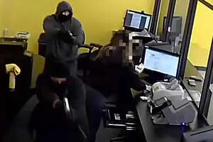 Video: Police search for armed robbers who stole money from Houston check cashing business