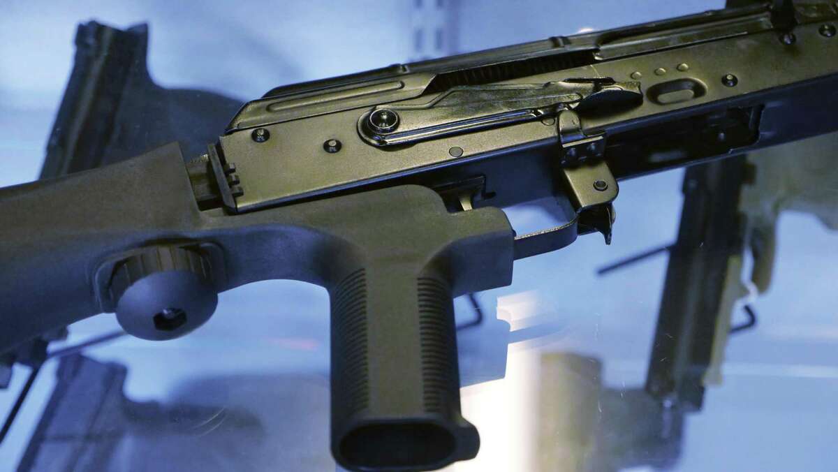 A device called a "bump stock" is attached to a semi-automatic rifle at the Gun Vault store and shooting range in Utah. Gov. Dannel P. Malloy wants to ban bump stocks and other devices that convert a semi-automatic assault rifle into a machine gun.