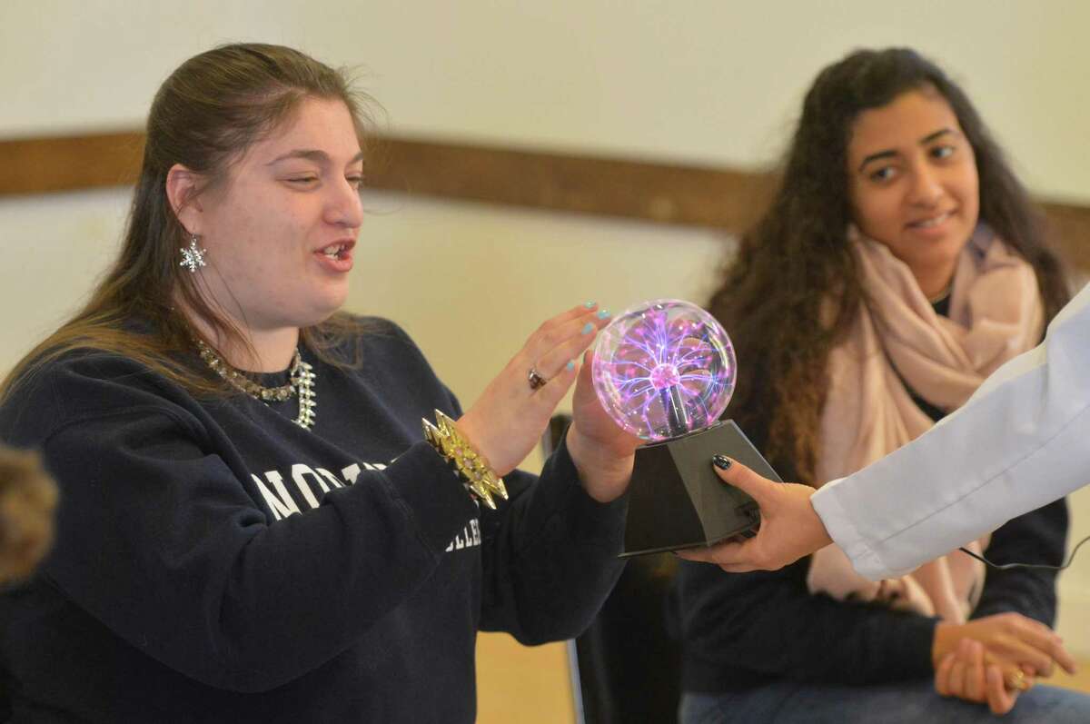 Hannah Costa gets a feel for electricity during a Mad Science program at Beth Israel of Westport/Norwalk Chabad with the Circle of Friends on Sunday, Jan. 8, in Norwalk. Every month, high-schoolers volunteer to be buddies with children, teenagers and young adults with special needs through Circle of Friends, a program meant to provide social interaction.