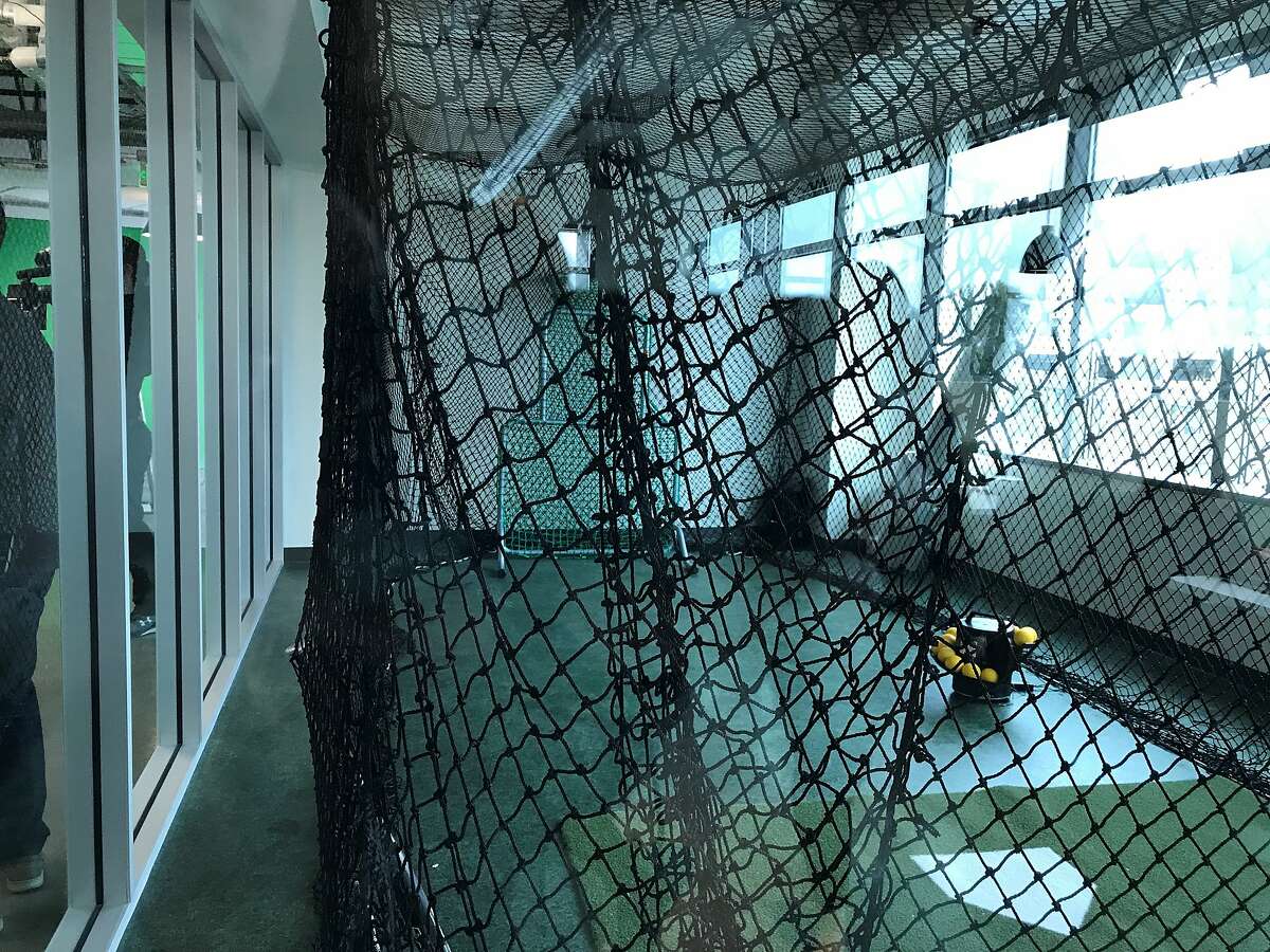 The A's moved into new offices in Jack London Square this week. Amenities include a gym, a batting cage, a mural by street-art crew the Illuminaries and team memorabilia displays, including, as pointed out by team president Dave Kaval, the orange baseball proposed by former owner Charlie Finley.