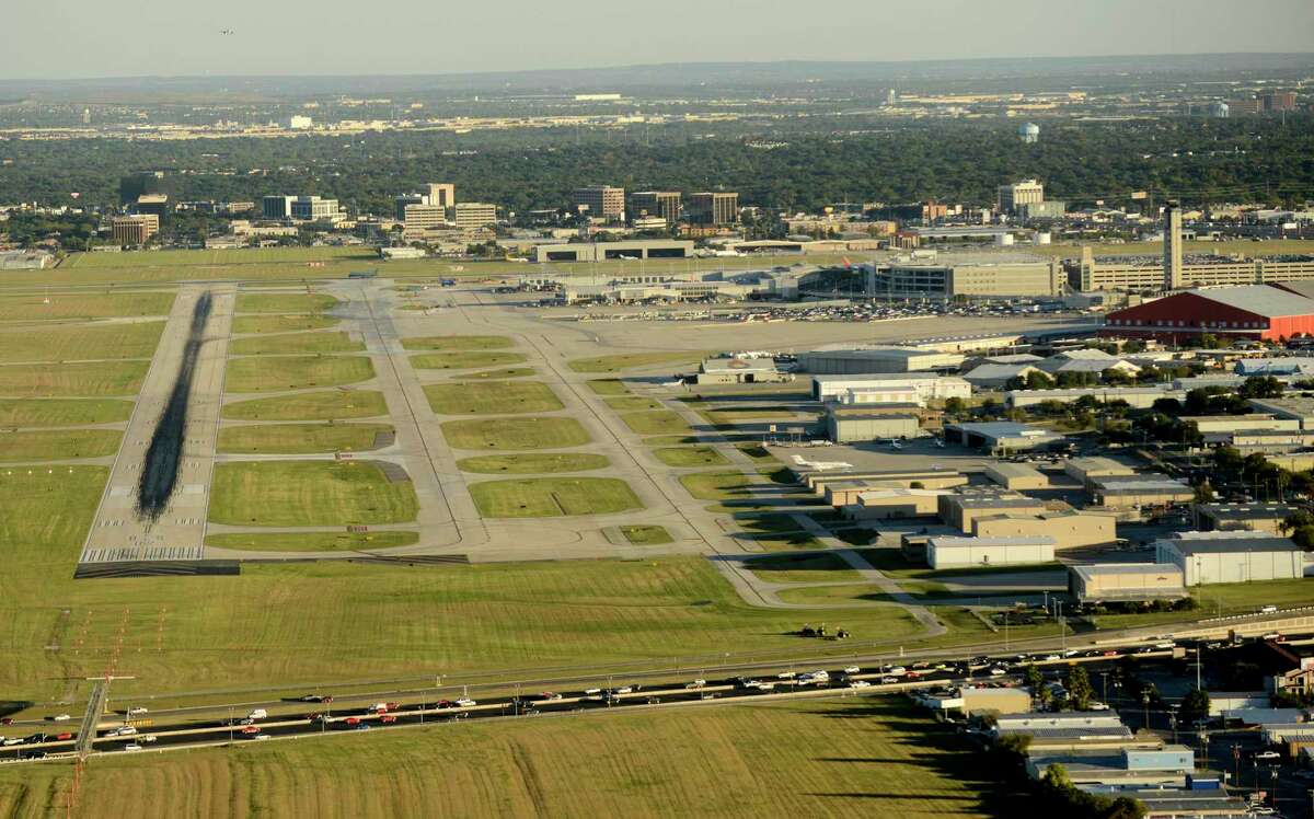 U.S. 281 traffic, bottom, flows by the San Antonio International Airport in this 2017 photo. Aviation officials are deciding the future of San Antonio International Airport, including whether to build a new terminal and add or extend runways. But instead of getting community input by holding public meetings in traditional venues such as high school cafeterias, they’ve been harvesting opinions at a coffee shop, a pizzeria on karaoke night and a senior citizens center.