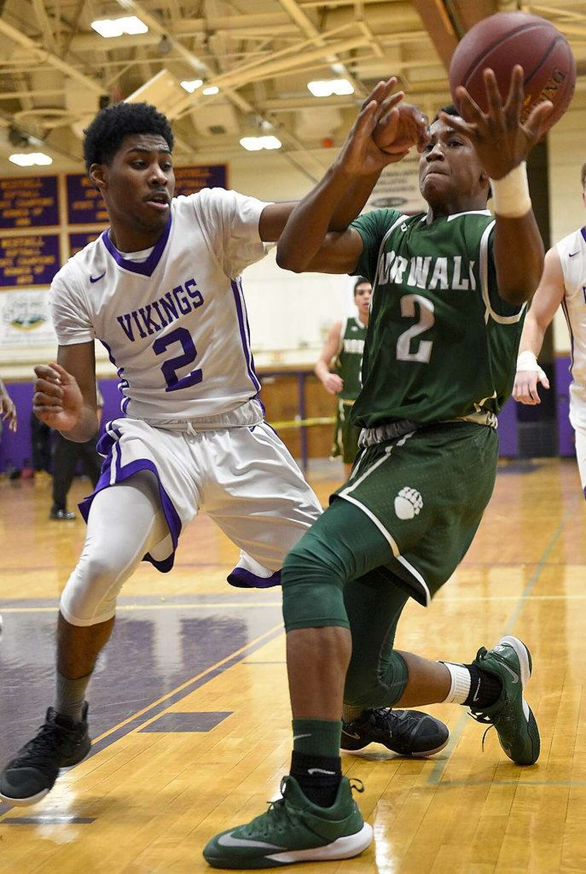 Westhill Rashawn Gibson (2) reachs in knocking the ball loose on Norwalk's Zyaire Sellers (2) drive during a FCIAC boys basketball game at Westhill High School in Stamford, Conn. on Tuesday, Jan. 9, 2018.