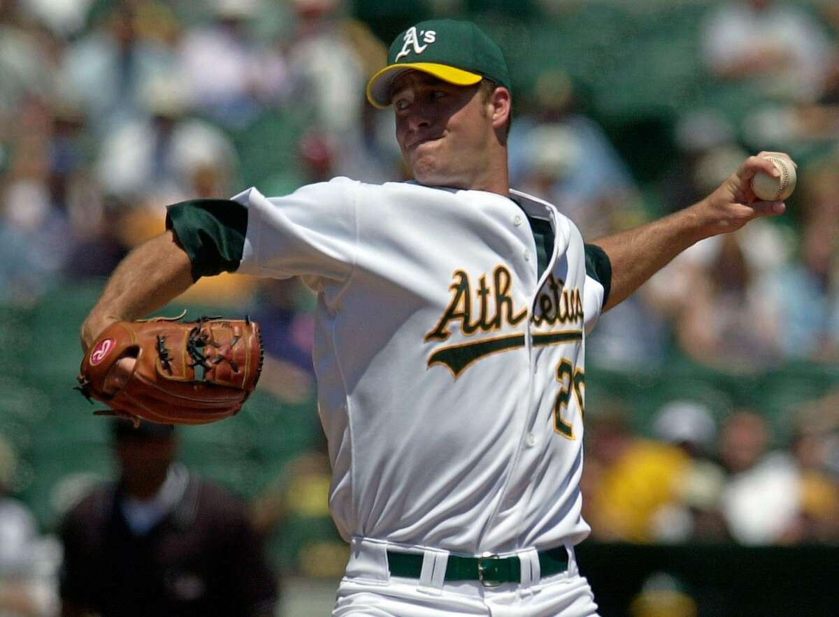 Oakland Athletics pitcher Mark Mulder delivers against the Cleveland Indians during the first inning Wednesday, July 31, 2002 in Oakland, Calif. Mulder recovered from a rocky second inning to win for the 10th time in 13 starts. (AP Photo/Julie Jacobson)