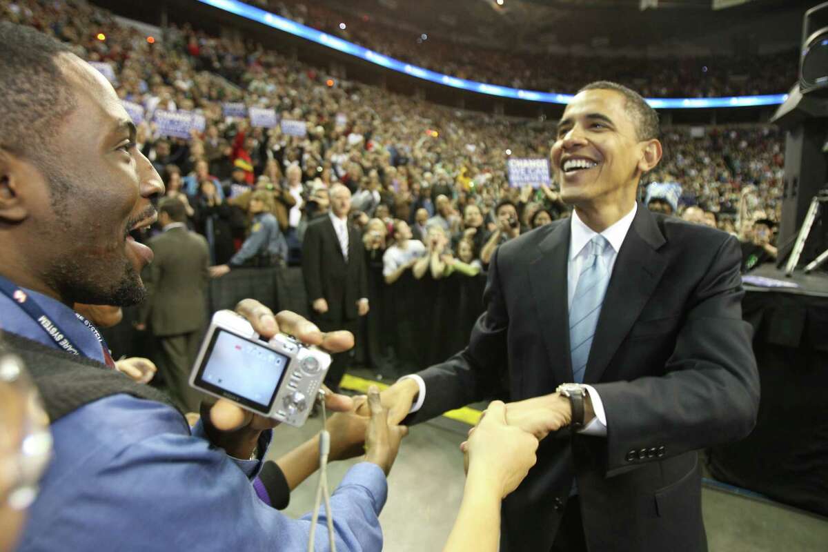 Barack Obama greets supporters after his speech at Key Arena in Seattle on Friday, February, 8, 2008. He returns to the Northwest on March 5 for paying gig sponsored by Greater Vancouver (B.C.) Board of Trade. 